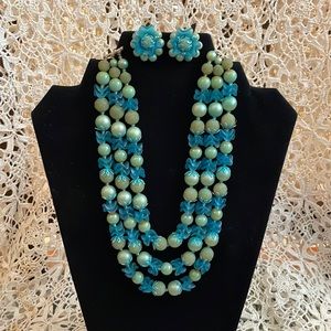 Vintage three tiered blue multi beaded necklace and matching clip earrings set.
